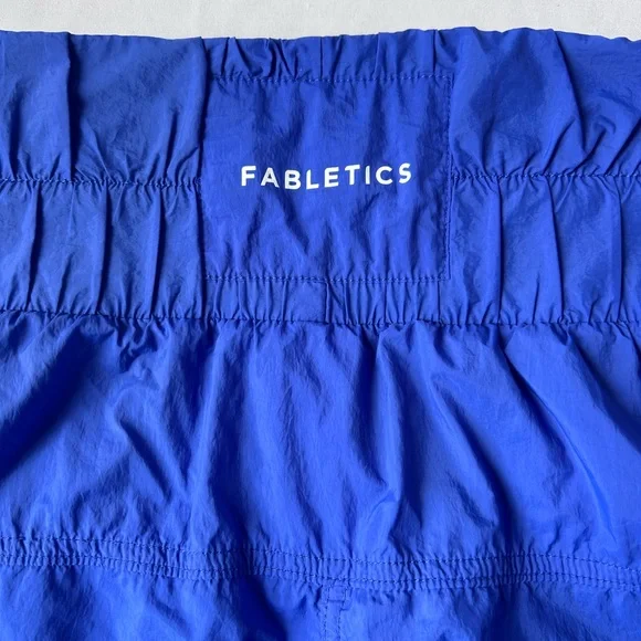 Fabletics Ultra High-Waisted Piped Nylon Short
Extreme royal/ reflective silver - Picture 3 of 4